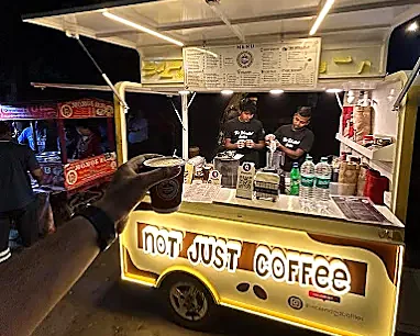 The Blended Bottles cart parked and lit up in Mayur Vihar at night